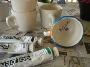 A retreat attendee paints her cup with a reminder we all need...Believe. When it comes to beliefs about yourself, what do you believe?